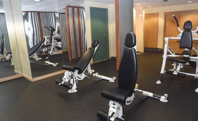 Weight lifting equipment in Park Place fitness center