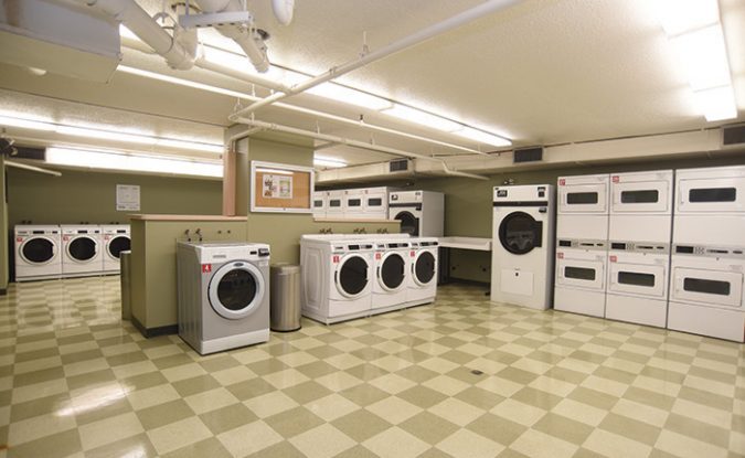 Multiple dryers and washers stacked and lined up against each other in Park Place laundry room