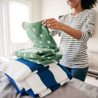 Woman folding towels